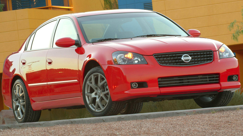 Front 3/4 view of a red Nissan Altima SE-R