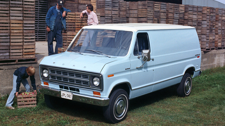 Front 3/4 view of a blue Ford Econoline van
