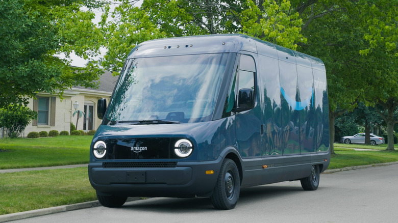 Front 3/4 view of a blue Rivian Amazon van