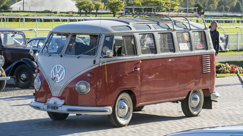 Front 3/4 view of a red and white Volkswagen Microbus