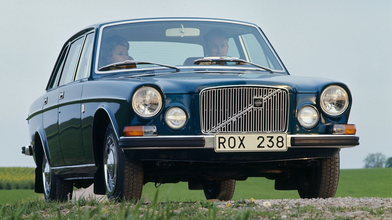Front end of a blue Volvo 164 sedan