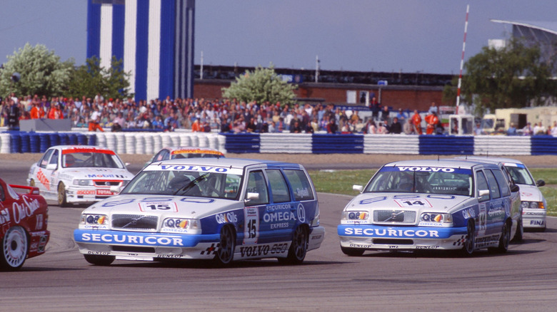 Two Volvo 850 race cars on track