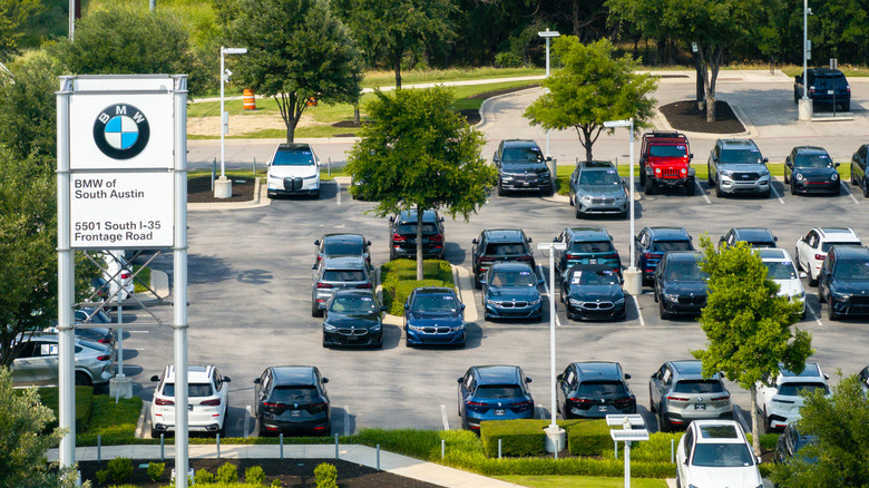 In an aerial view, vehicles are displayed for sale on a lot at the BMW of South Austin dealership on May 16, 2025 in Austin, Texas.