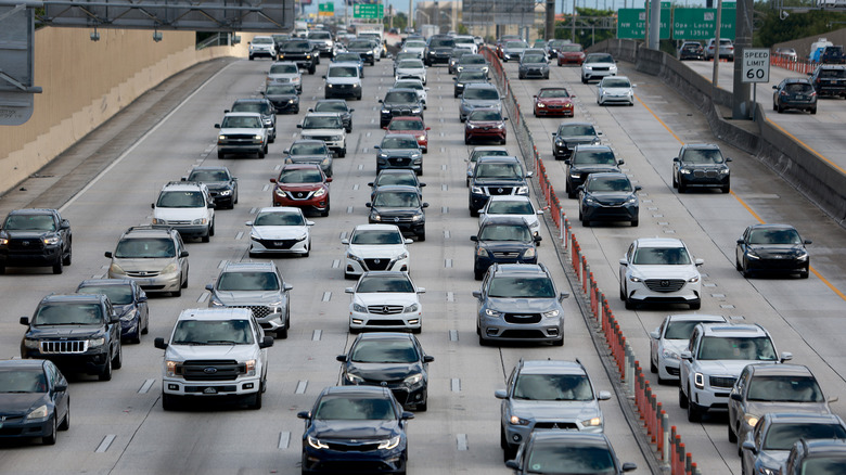 Vehicles are driven along I-95 on June 30, 2022 in Miami, Florida.