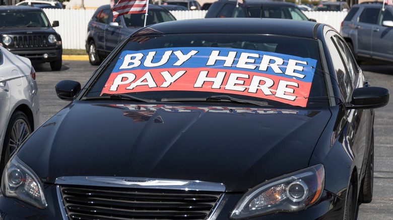 Kokomo - Circa October 2022: Buy Here Pay Here Used Car Dealer. Many buy here, pay here car dealerships do not require good credit but may track your car if you miss payments.