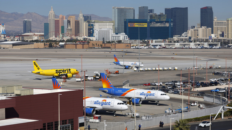 Allegiant Air craft and a Spirit Airlines airplane are parked astatine Harry Reid International Airport pinch edifice and casinos connected nan Las Vegas Strip successful nan inheritance connected March 15, 2025 successful Las Vegas, Nevada.