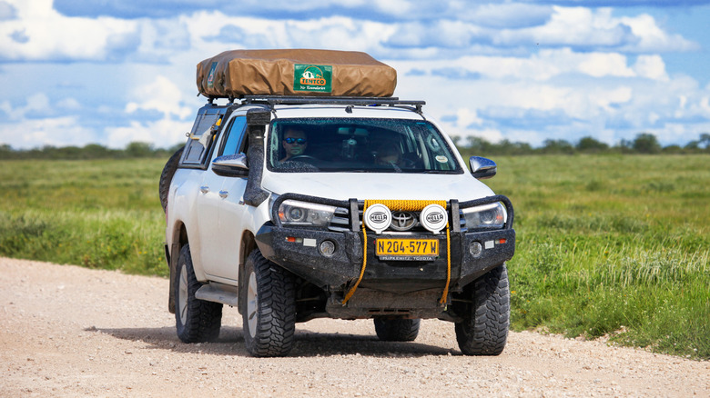 Etosha National Park, Namibia - February 6, 2020: Offroad motorhome Toyota Hilux at the countryside.