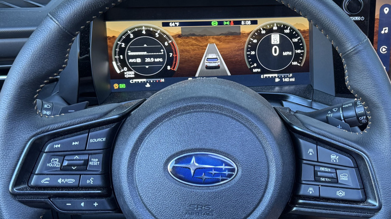 close up of the steering wheel and digital gauges in the Subaru Outback Wilderness