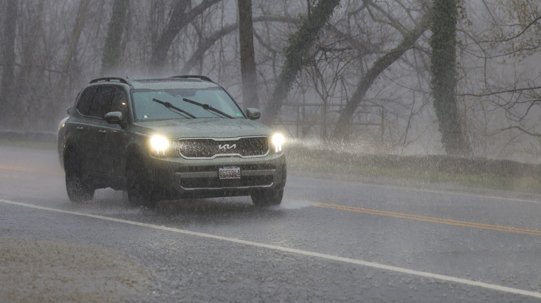 WASHINGTON, DC - MARCH 16: A car drives through heavy rain on Clara Barton Parkway on March 16, 2026 in Washington, DC. Severe storms brought high winds, thunderstorms and tornado warnings to parts of Washington, D.C. and Maryland on Monday. (Photo by Heather Diehl/Getty Images)