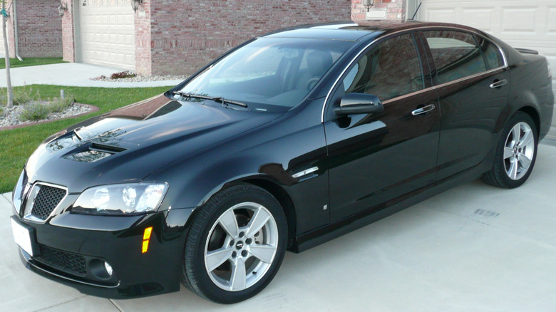 A black 2009 Pontiac G8 GT in a driveway