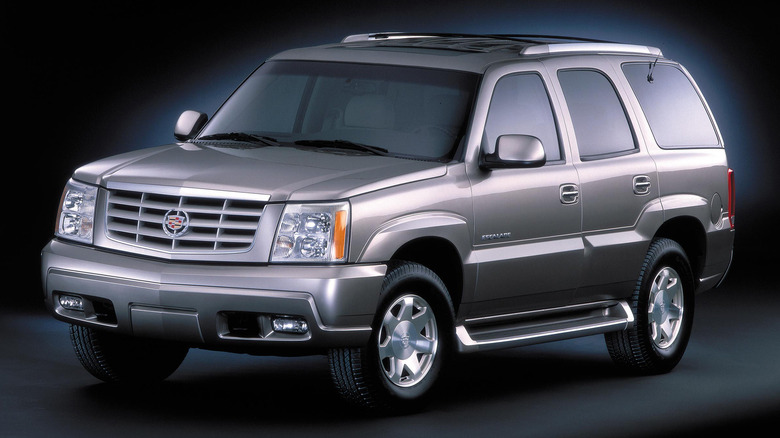 Front 3/4 view of a silver Cadillac Escalade