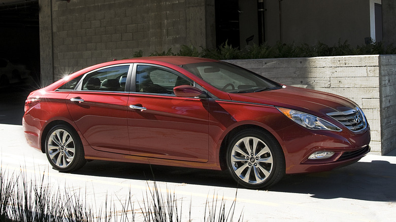 Side view of a red 2011 Hyundai Sonata
