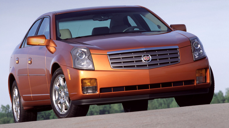 Front 3/4 view of an orange Cadillac CTS