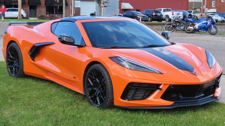 2024 Chevrolet Corvette Stingray R coupe photographed at a car cruise in Lowellville, Ohio. Finished in Amplify Orange Tintcoat.