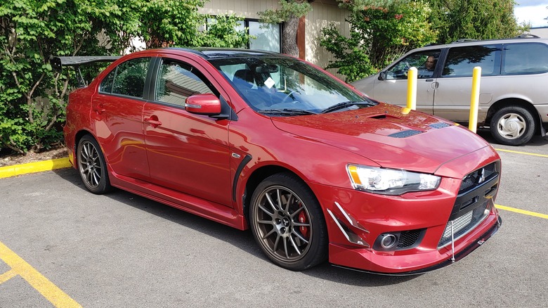 Left view of a Mitsubishi Lancer Evolution X Final Edition, with APR Performance aftermarket parts.