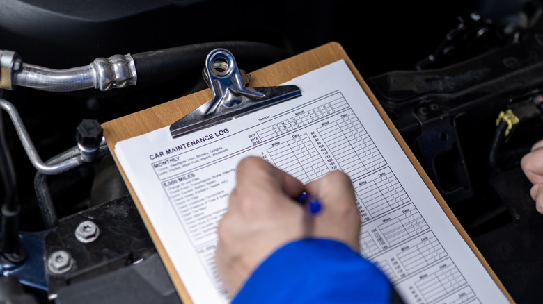 Vehicle maintenance log being maintained.