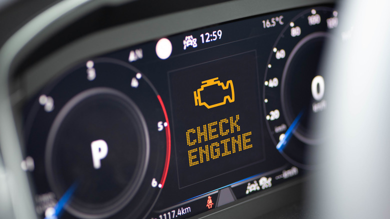 Check engine light on a dashboard.