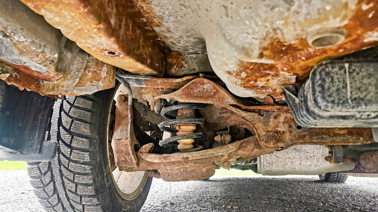 Rust underneath vehicle causing corrosion.