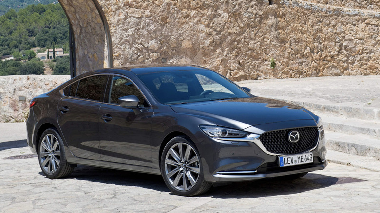 Mazda 6 surrounded by stone.