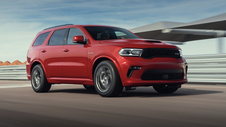 A red Dodge Durango driving down a track