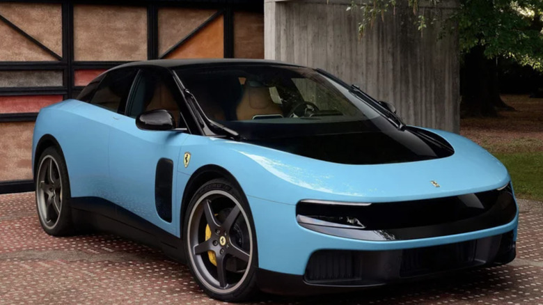A blue Ferrari Luce parked in a driveway