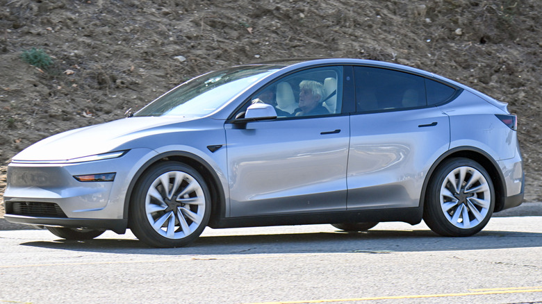 Jay Leno is seen driving the new Tesla Model Y while filming for Jay Leno's Garage on January 31, 2025 in Los Angeles, California.