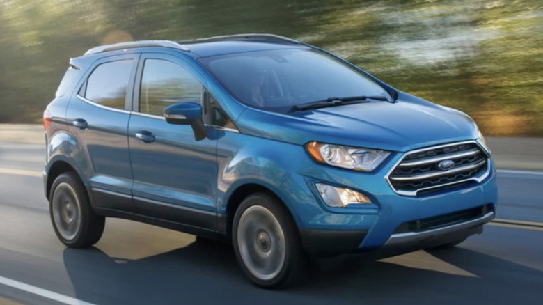 A blue Ford EcoSport SUV being driven on a highway