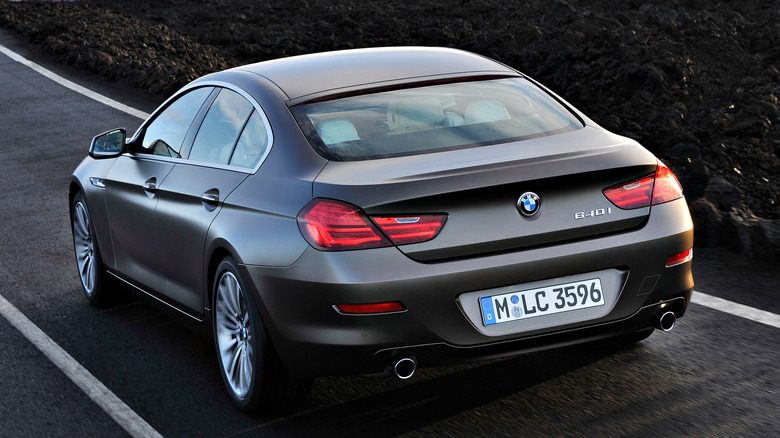 The rear 3/4 of a BMW 640i being driven along the road