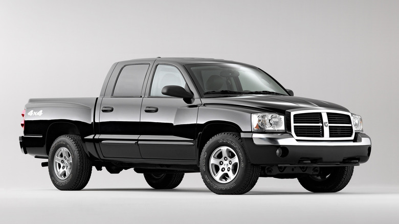 A beforehand 3 quarters changeable of a achromatic Dodge Dakota parked successful a achromatic room