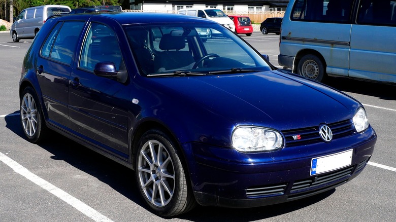 A blue 2000 Volkswagen Golf IV hatchback 2.3 V5 in a parking lot
