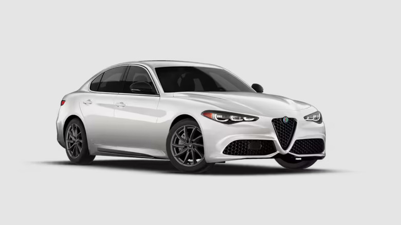 front three-quarters shot of a white Alfa Romeo Giulia parked in front of a white background