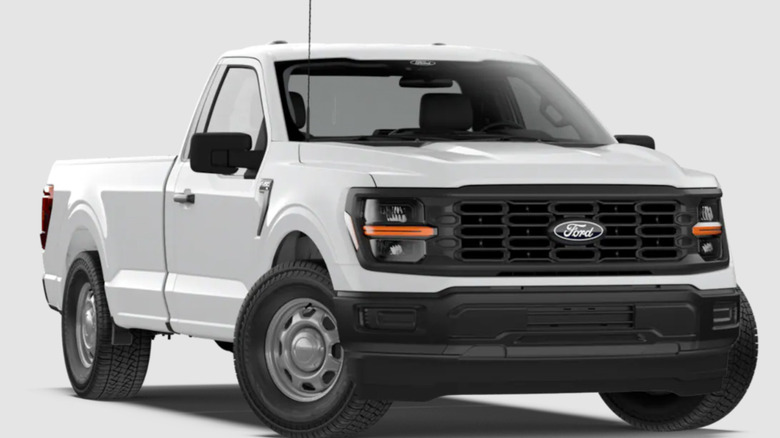front three-quarters shot of a white Ford F-150 XL single cab parked in front of a white background