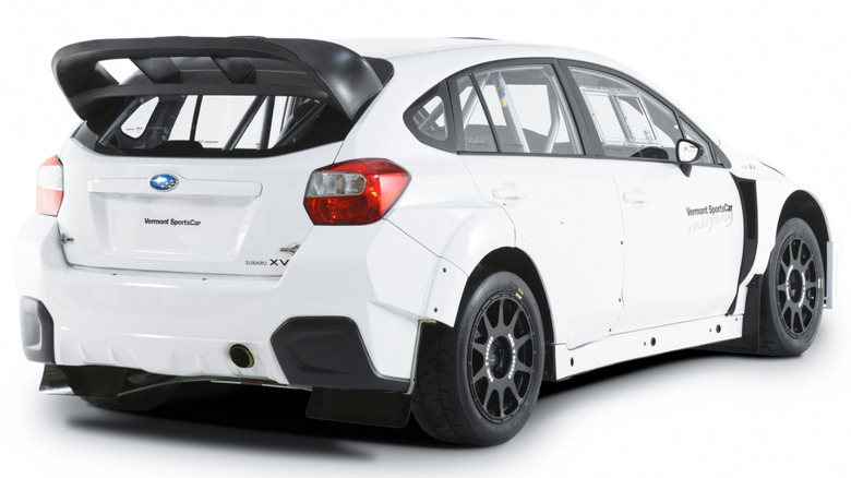 Rear 3/4 view of a white rally-prepped Subaru XV