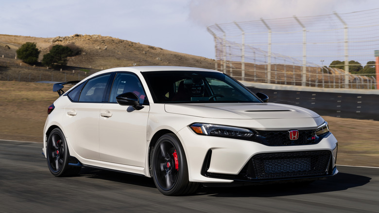 Front 3/4 view of a white Honda Civic Type R