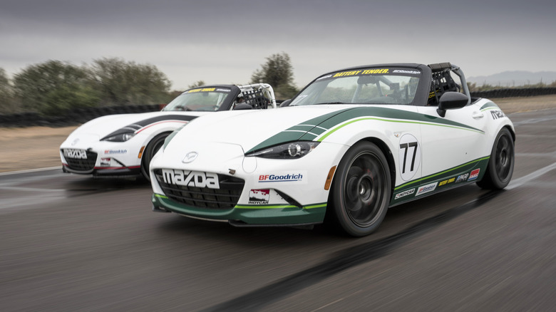 Front 3/4 view of a white Mazda MX-5 Miata race car