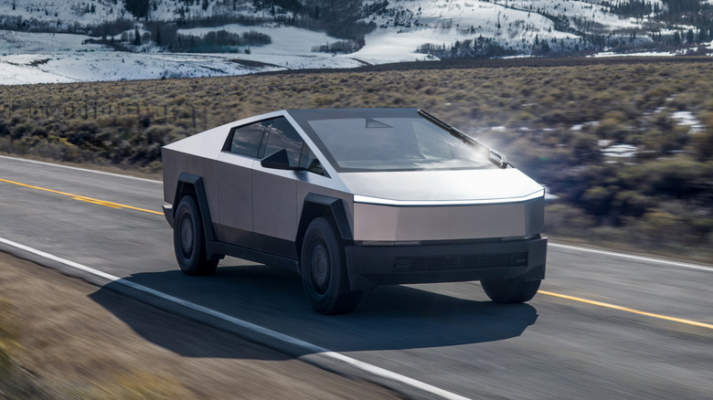Front 3/4 view of a Tesla Cybertruck driving