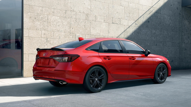 Rear 3/4 view of a red Honda Civic Si