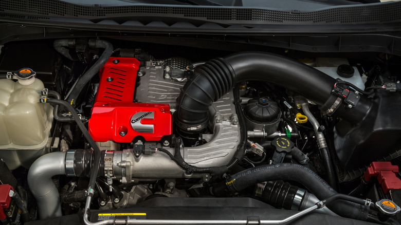 The engine shot from a yellow 2016 Nissan Titan XD with Cummins V8