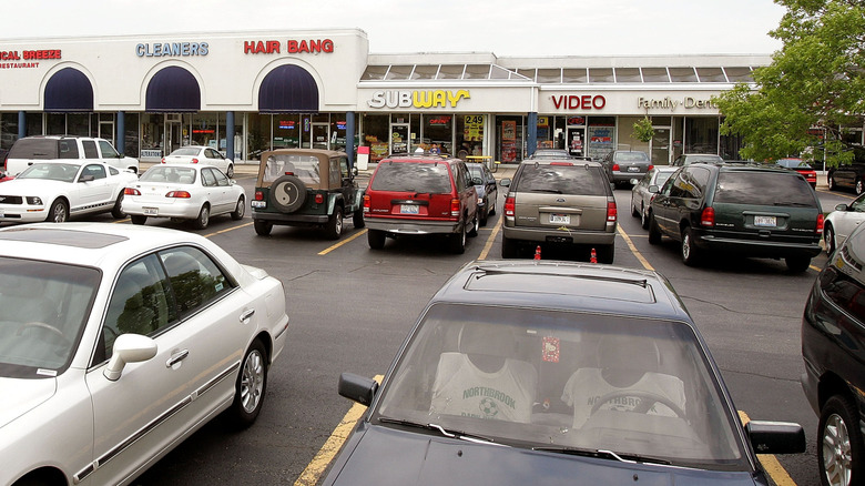 Cars are seen parked in a shopping strip mall May 18, 2005 in Mount Prospect, Illinois. Strip malls have become a prominent suburban feature nationwide.