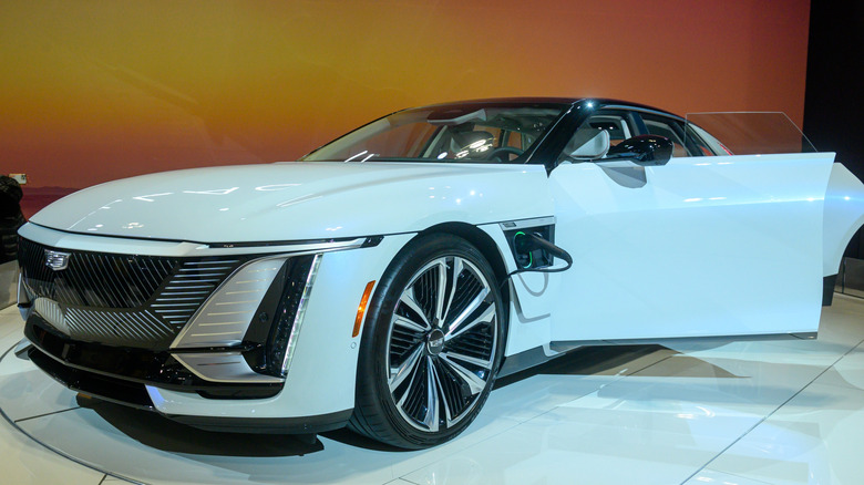 A light blue Cadillac Celestiq parked on display with its driver's door open.