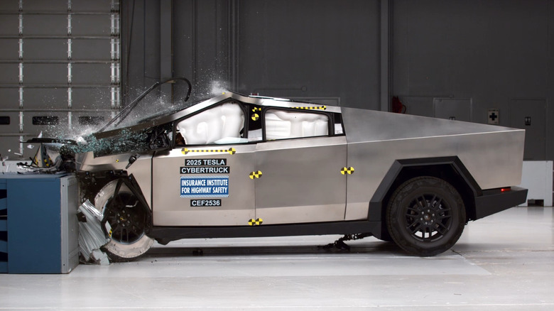 A photo the moment the IIHS's Tesla Cybertruck smashes into the barrier in the moderate front overlap crash test