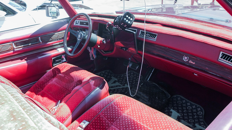 Plush red seats in a vintage car
