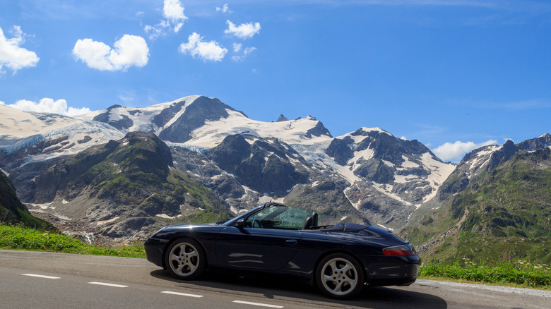 A Porsche 911 convertible in the mountains
