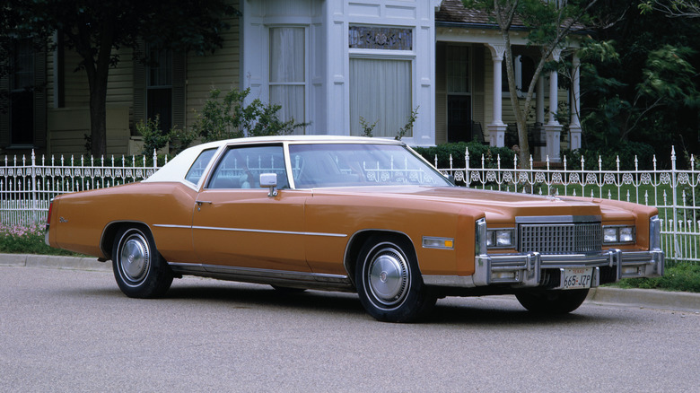 A brown Cadillac El Dorado coupe