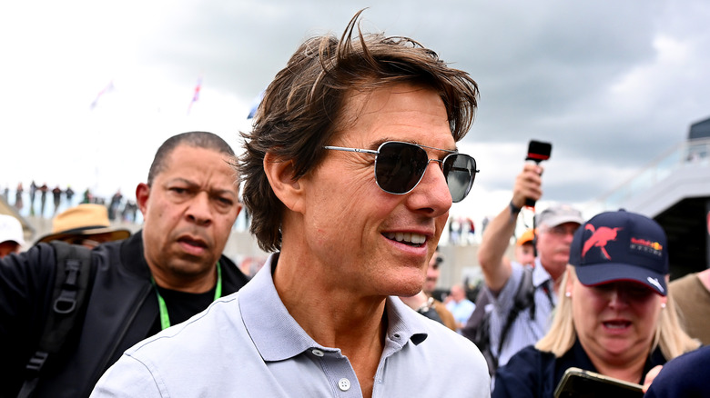 Actor Tom Cruise walks in the Paddock prior to the F1 Grand Prix of Great Britain at Silverstone on July 03, 2022 in Northampton, England.