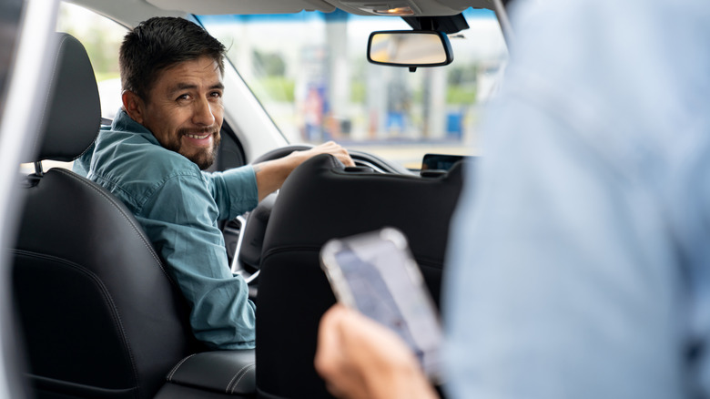 Man looking back in a car