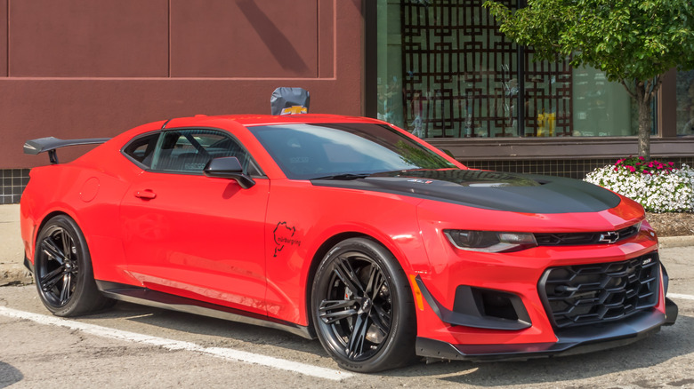 A red Chevrolet Camaro ZL1 1LE in a parking spot.