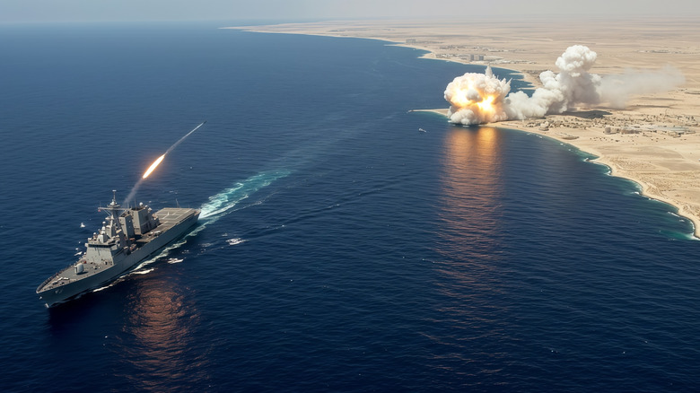A US Navy warship fires shots at a target.