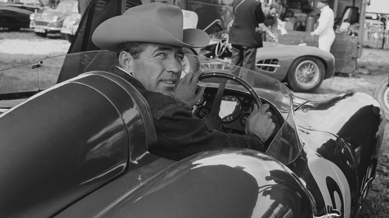 American racing driver Carroll Shelby (1923-2012) sits in an Aston Martin DBR 1/300 race car in the paddock ahead of the RAC Tourist Trophy race, Goodwood, Sussex, September 13th 1958. (Photo by Evening Standard/Hulton Archive/Getty Images)