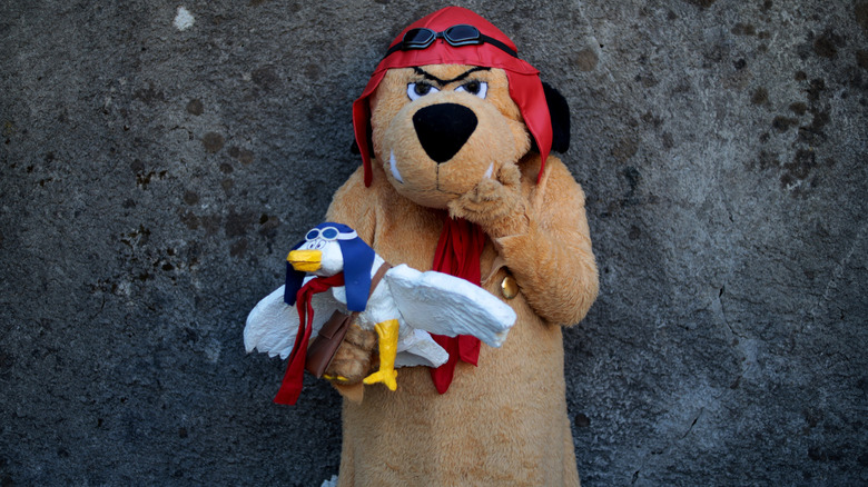 Lucca, Tuscany, Italy - October 30, 2022: Cosplayer dressed as Muttley, from the animated series Wacky Races at the Lucca Comics and Games 2022 cosplay event.